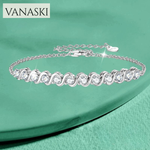 Silver bracelet with clear stones on a green background, featuring the Vanaski brand.
