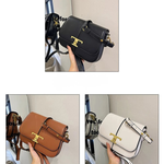 Black, brown, and white handbags with gold accents held by a hand against a neutral background.