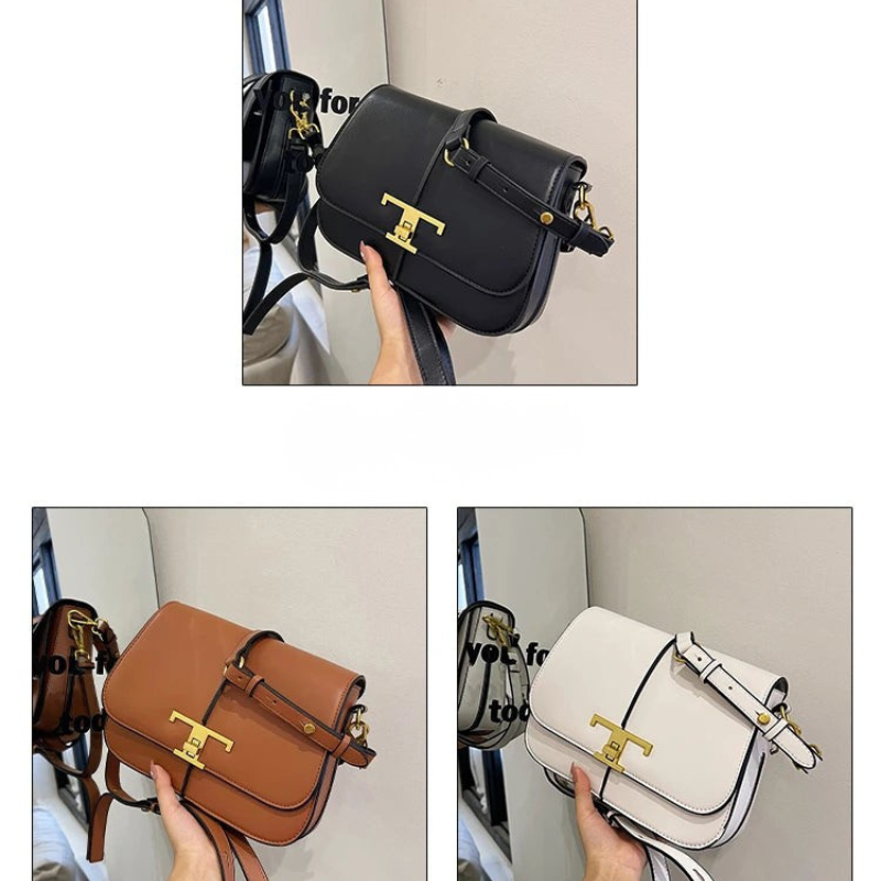 Black, brown, and white handbags with gold accents held by a hand against a neutral background.