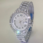 Luxury diamond-encrusted watch with Roman numeral markers on a light gray background