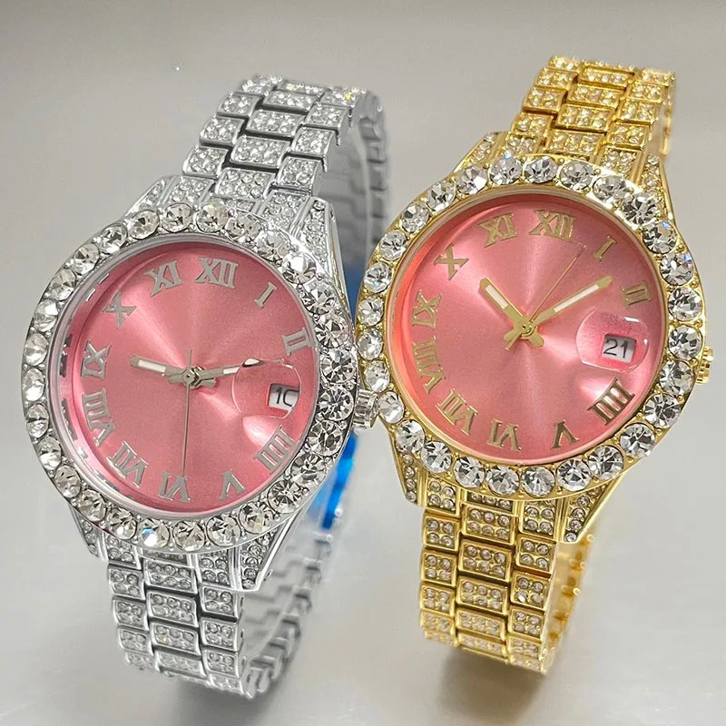 Two ornate wristwatches, one silver and one gold, with pink faces and diamond-studded bezels.